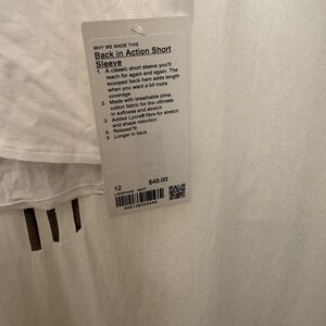 Lululemon Athletica White back in action Short Sleeve Tee
